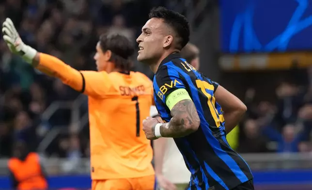 Inter Milan's Lautaro Martinez runs after scoring his side's opening goal during the Champions League opening phase soccer match between Inter Milan and Club Brugge in Milan, Italy, Tuesday, Oct. 13, 2026. (AP Photo/Luca Bruno)
