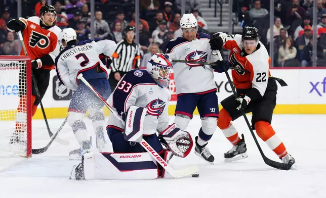 Columbus Blue Jackets goaltender Cam Talbot (33) makes a save during the second period of an NHL hockey game against the Philadelphia Flyers, Tuesday, Oct. 27, 2026, in Philadelphia. (AP Photo/Derik Hamilton)