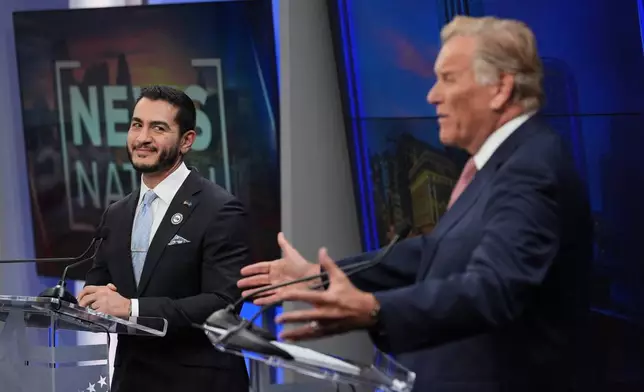 Republican nominee for U.S. Senate Mike Rogers, right, speaks during a televised debate with Democratic nominee for U.S. Senate Abdul El-Sayed, at WOOD-TV, on Thursday, Oct. 8, 2026, in Grand Rapids, Mich. (AP Photo/Paul Sancya, Pool)