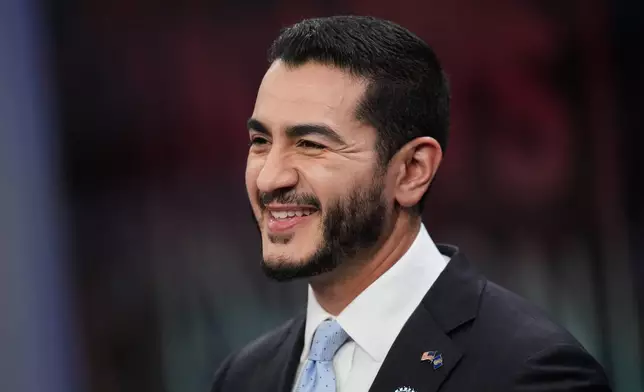 Democratic nominee for U.S. Senate Abdul El-Sayed, smiles during a televised debate with Republican nominee for U.S. Senate Mike Rogers at WOOD-TV, on Thursday, Oct. 8, 2026, in Grand Rapids, Mich. (AP Photo/Paul Sancya, Pool)