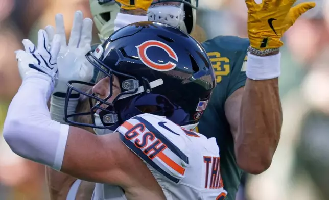 Green Bay Packers' Christian Watson catches a touchdown pass over Chicago Bears' Dillon Thieneman during the second half of an NFL football game in Green Bay, Wis., Sunday, Oct. 11, 2026. (AP Photo/Matt Ludtke)