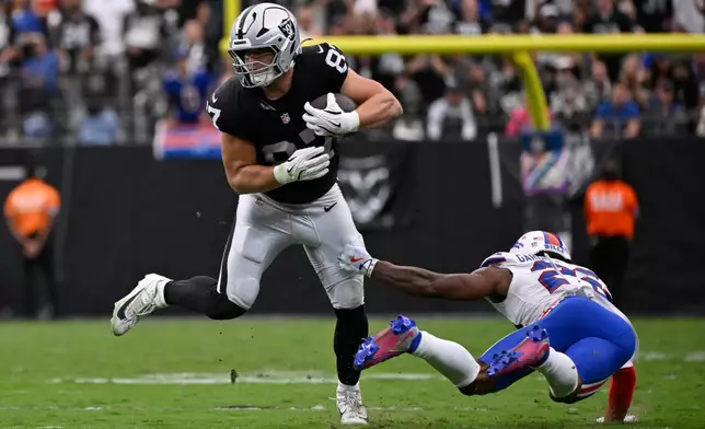 Las Vegas Raiders tight end Michael Mayer (87) makes a catch in front of Buffalo Bills safety C.J. Gardner-Johnson (22) during an NFL football game in Las Vegas, Sunday, Oct. 18, 2026. (AP Photo/David Becker)