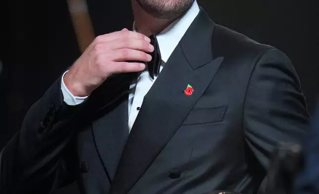 England's soccer player Harry Kane wins the player of the year trophy during the Ballon d'Or ceremony at the London Palladium Theatre in London, England, Monday, Oct. 26, 2026 . (AP Photo/Kin Cheung)