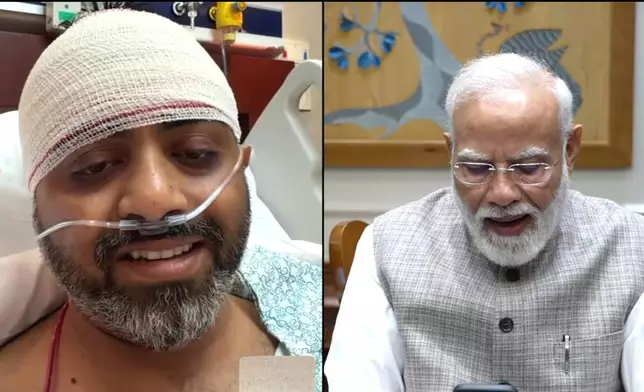 This screengrab from Narendra Modi YouTube Channel shows Indian Prime Minister Narendra Modi speaking with FlyDubai pilot Capt. Smit Machchhar on Friday, Oct. 2, 2026. (Narendra Modi YouTube Channel via AP )