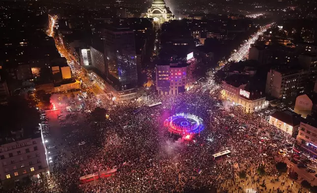 People celebrate after Aleksandar Vucic, leader of the right-wing Serbian Progressive Party (SNS) conceded defeat in the parliamentary election in Belgrade, Serbia, Sunday, Oct. 25, 2026. (AP Photo/Armin Durgut)