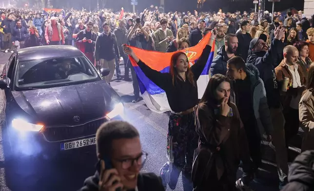 People celebrate after Aleksandar Vucic, leader of the right-wing Serbian Progressive Party (SNS) conceded defeat in the parliamentary election in Belgrade, Serbia, Sunday, Oct. 25, 2026. (AP Photo/Armin Durgut)