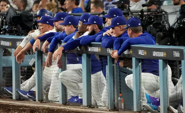 The Los Angeles Dodgers watch during the eighth inning of Game 4 of baseball's National League Championship Series between the Milwaukee Brewers and the Los Angeles Dodgers, Thursday, Oct. 15, 2026, in Los Angeles. (AP Photo/Mark J. Terrill)