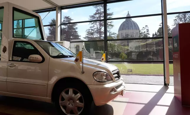 A popemobile used by successive popes is displayed at "A Century of the Popemobile," an exhibition tracing 100 years of papal transportation, from Pope Pius XI's first automobile in 1930 to modern popemobiles, at the Vatican Museums, Wednesday, Oct. 28, 2026. (AP Photo/Isaia Montelione)