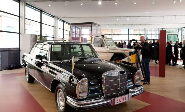 A popemobile used by successive popes is displayed at "A Century of the Popemobile," an exhibition tracing 100 years of papal transportation, from Pope Pius XI's first automobile in 1930 to modern popemobiles, at the Vatican Museums, Wednesday, Oct. 28, 2026. (AP Photo/Isaia Montelione)