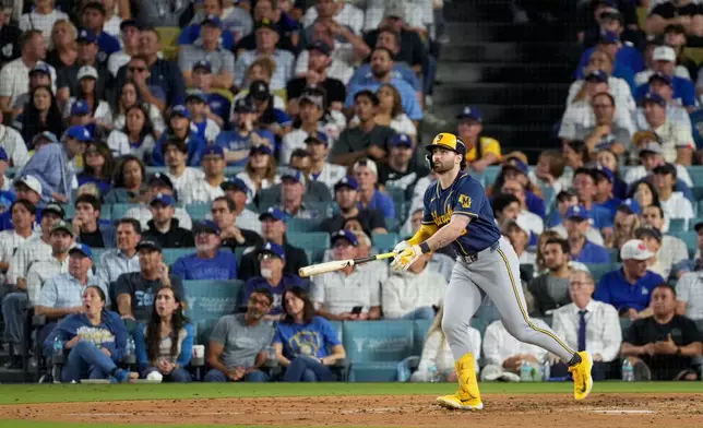 Milwaukee Brewers center fielder Garrett Mitchell follows through on his solo home run during the sixth inning of Game 4 of baseball's National League Championship Series between the Milwaukee Brewers and the Los Angeles Dodgers, Thursday, Oct. 15, 2026, in Los Angeles. (AP Photo/Mark J. Terrill)
