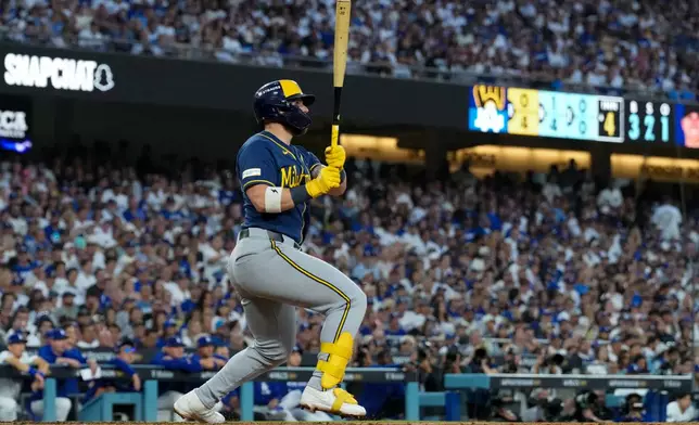 Milwaukee Brewers first baseman Jake Bauers connects for a two-RBI double during the fourth inning of Game 4 of baseball's National League Championship Series between the Milwaukee Brewers and the Los Angeles Dodgers, Thursday, Oct. 15, 2026, in Los Angeles. (AP Photo/Ashley Landis)