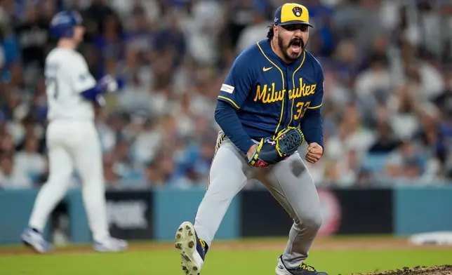 Milwaukee Brewers pitcher Jojo Romero celebrates an out during the sixth inning of Game 4 of baseball's National League Championship Series between the Milwaukee Brewers and the Los Angeles Dodgers, Thursday, Oct. 15, 2026, in Los Angeles. (AP Photo/Ashley Landis)