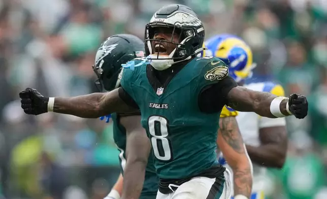 Philadelphia Eagles running back Tank Bigsby (8) celebrates a first down during the second half of an NFL football game against the Los Angeles Rams in Philadelphia, Sunday, Oct. 4, 2026. (AP Photo/Matt Slocum)