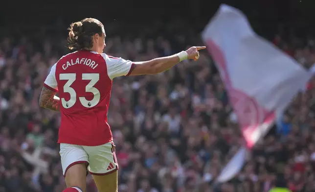 Arsenal's Riccardo Calafiori celebrates after scoring his side's opening goal during the English Premier League soccer match between Arsenal and Leeds United in London, Saturday, Oct. 10, 2026. (AP Photo/Alastair Grant)