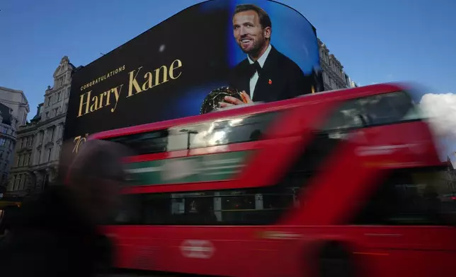 An image of England's soccer player Harry Kane, winner of the Ballon D'Or, is displayed on a large screen at Piccadilly Circus in London, Tuesday, Oct. 27, 2026. (AP Photo/Alastair Grant)
