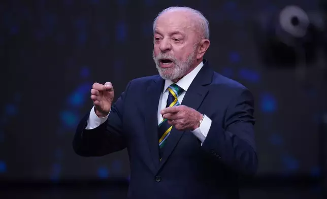 Brazilian President Luiz Inacio Lula da Silva, who is running for reelection, speaks and gestures during a televised presidential debate one week before the presidential runoff election in Sao Paulo, Brazil, Sunday, Oct. 18, 2026. (AP Photo/Andre Penner)
