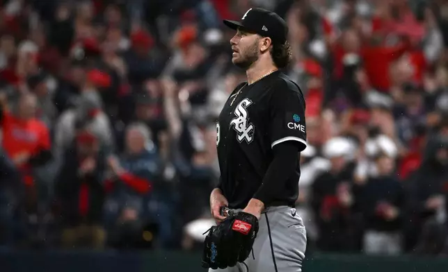 Chicago White Sox pitcher Sean Burke reacts after a home run by Cleveland Guardians' José Ramírez during the fourth inning of Game 5 of baseball's American League Division Series, Saturday, Oct. 10, 2026, in Cleveland. (AP Photo/Phil Long)