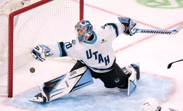 Utah Mammoth Karel Vejmelka reaches for the puck on a goal by Boston Bruins' Morgan Geekie during the second period of an NHL hockey game, Thursday, Oct. 8, 2026, in Boston. (AP Photo/Charles Krupa)