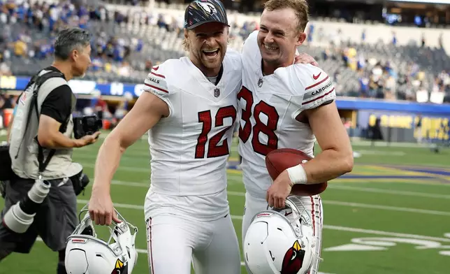 Arizona Cardinals kicker Chad Ryland, right, celebrates with Blake Gillikin (12) after an NFL football game against the Los Angeles Rams in Inglewood, Calif., Sunday, Oct. 18, 2026. (AP Photo/Caroline Brehman)