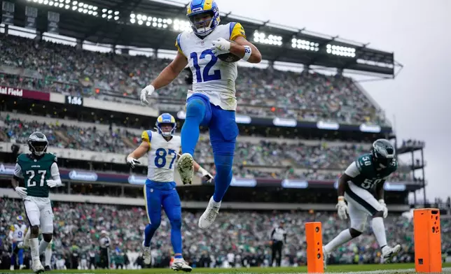 Los Angeles Rams wide receiver Puka Nacua (12) scores a touchdown during the first half of an NFL football game against the Philadelphia Eagles in Philadelphia, Sunday, Oct. 4, 2026. (AP Photo/Matt Slocum)