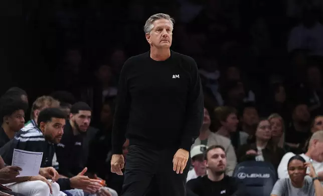 Minnesota Timberwolves head coach Chris Finch looks on during the first half of an NBA basketball game against the Toronto Raptors, Sunday, Oct. 25, 2026, in Minneapolis. (AP Photo/Bailey Hillesheim)