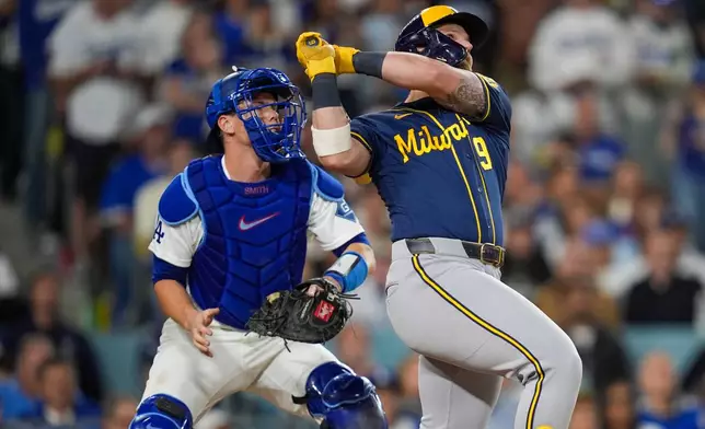 Milwaukee Brewers first baseman Jake Bauers connects for a two run home run as Los Angeles Dodgers catcher Will Smith looks on during the seventh inning of Game 3 of baseball's National League Championship Series between the Milwaukee Brewers and the Los Angeles Dodgers, Wednesday, Oct. 14, 2026, in Los Angeles.(AP Photo/Gregory Bull)