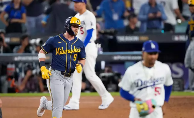 Milwaukee Brewers first baseman Jake Bauers (9) rounds the bases after hitting a two RBI home run during the seventh inning of Game 3 of baseball's National League Championship Series between the Milwaukee Brewers and the Los Angeles Dodgers, Wednesday, Oct. 14, 2026, in Los Angeles. (AP Photo/Mark J. Terrill)