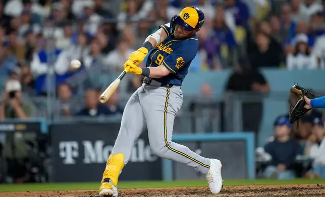 Milwaukee Brewers first baseman Jake Bauers connects for a two run home run during the seventh inning of Game 3 of baseball's National League Championship Series between the Milwaukee Brewers and the Los Angeles Dodgers, Wednesday, Oct. 14, 2026, in Los Angeles. (AP Photo/Ashley Landis)