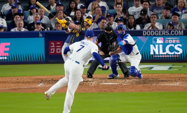 Milwaukee Brewers first baseman Jake Bauers (9) connects for a two RBI home run off Los Angeles Dodgers pitcher Blake Snell (7) during the seventh inning of Game 3 of baseball's National League Championship Series between the Milwaukee Brewers and the Los Angeles Dodgers, Wednesday, Oct. 14, 2026, in Los Angeles. (AP Photo/Mark J. Terrill)