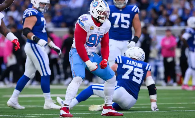 FILE - Tennessee Titans defensive tackle Jeffery Simmons (98) celebrates a sack during an NFL football game against the Indianapolis Colts in Indianapolis, Sunday, Oct. 18, 2026. (AP Photo/Zach Bolinger, File)