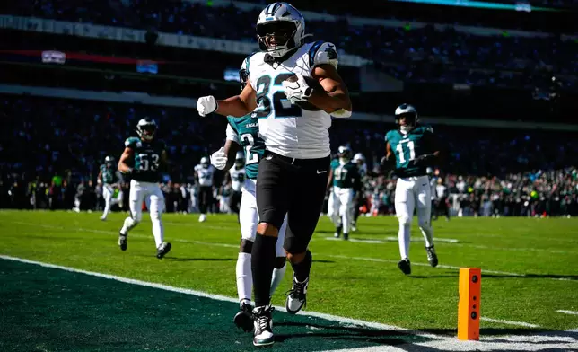 Carolina Panthers tight end Tommy Tremble scores a touchdown during the first half of an NFL football game against the Philadelphia Eagles in Philadelphia, Sunday, Oct. 18, 2026. (AP Photo/Matt Slocum)