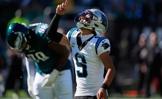 Carolina Panthers quarterback Bryce Young reacts to his touchdown pass to Panthers tight end Tommy Tremble during the first half of an NFL football game against the Philadelphia Eagles in Philadelphia, Sunday, Oct. 18, 2026. (AP Photo/Chris Szagola)
