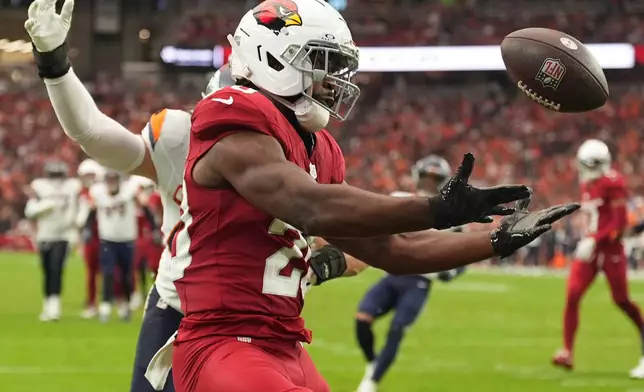 Arizona Cardinals running back Bam Knight (20) misses a touchdown catch against the Denver Broncosv during the first half of an NFL football game in Glendale, Ariz., Sunday, Oct. 25, 2026. (AP Photo/Ross D. Franklin)