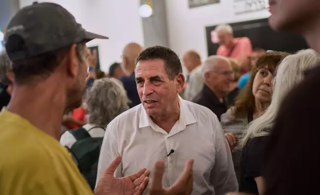Yoav Segalovitz, a former police investigator running with the Ra'am party, speaks with attendees at a campaign event in Tel Aviv, Israel, Friday, Oct. 23, 2026, ahead of the country's general election. (AP Photo/David Goldman)
