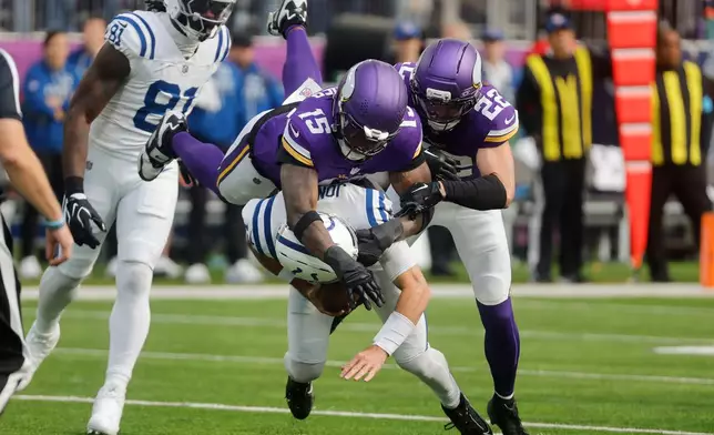 Minnesota Vikings linebacker Dallas Turner (15) sacks Indianapolis Colts quarterback Daniel Jones during the first half of an NFL football game in Minneapolis, Sunday, Oct. 25, 2026. (AP Photo/Bruce Kluckhohn)