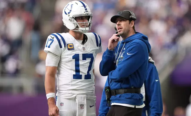 Indianapolis Colts quarterback Daniel Jones (17) talks with head coach Shane Steichen during the first half of an NFL football game against the Minnesota Vikings in Minneapolis, Sunday, Oct. 25, 2026. (AP Photo/Ellen Schmidt)
