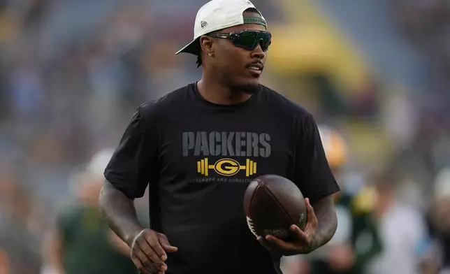 FILE - Green Bay Packers running back Josh Jacobs stands on the field before a preseason NFL football game against the Arizona Cardinals, Aug. 28, 2026, in Green Bay, Wis. (AP Photo/Abbie Parr, File)