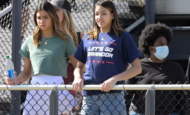 FILE - A spectator wears a Let's Go Brandon shirt in the stands during the first half of the Hula Bowl NCAA college football game, Jan. 15, 2022, in Orlando, Fla. (AP Photo/Phelan M. Ebenhack, File)