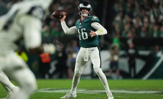 Philadelphia Eagles quarterback Tanner McKee (16) looks to pass during the first half of an NFL football game against the Dallas Cowboys in Philadelphia, Monday, Oct. 26, 2026. (AP Photo/Matt Rourke)