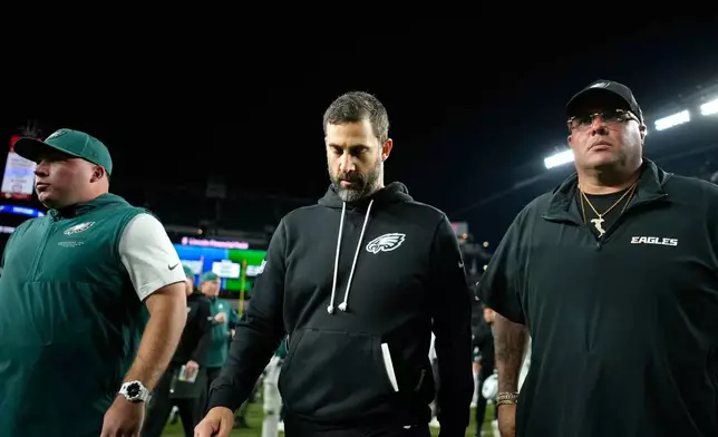 Philadelphia Eagles head coach Nick Sirianni, center, leaves the field after an NFL football game against the Dallas Cowboys in Philadelphia, Monday, Oct. 26, 2026. (AP Photo/Matt Slocum)