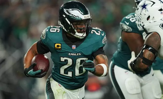 Philadelphia Eagles running back Saquon Barkley runs the ball during the second half of an NFL football game against the Dallas Cowboys in Philadelphia, Monday, Oct. 26, 2026. (AP Photo/Matt Rourke)