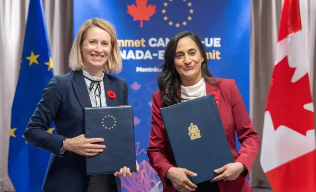 Canada Minister of Foreign Affairs Anita Anand, right and High Representative of the European Union for Foreign Affairs and Security Policy Kaja Kallas pose after signing the Canada-EU Host Country Agreement in Montreal, Thursday, Oct. 29, 2026. (Christopher Katsarov/The Canadian Press via AP)