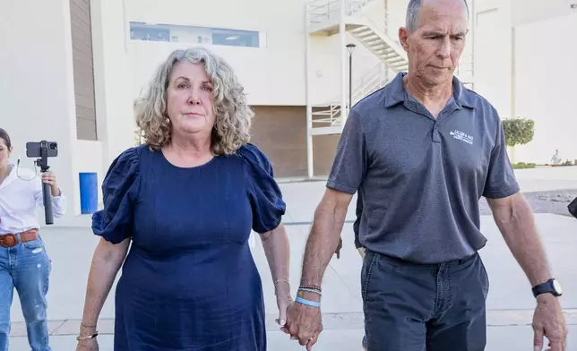 Debra and Martin Robinson, parents of Australian brothers Callum and Jake Robinson, leave the courthouse after the trial of the men accused of murdering the brothers and an American friend, in Ensenada, Mexico, Friday, Oct. 9, 2026. (AP Photo/Karen Castaneda)