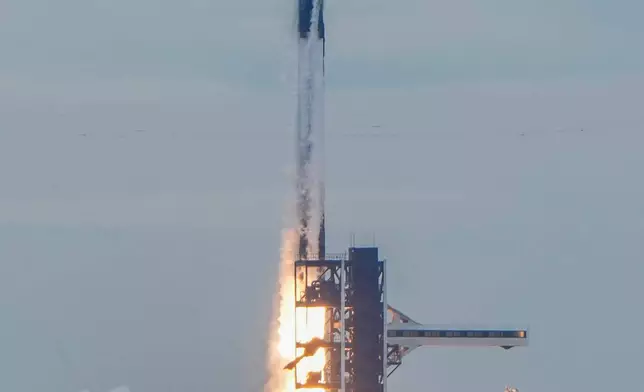 A SpaceX Falcon 9 rocket with a crew of four launches from pad 40 at the Cape Canaveral Space Force Station in Cape Canaveral, Fla., Thursday, Oct. 1, 2026. (AP Photo/John Raoux)