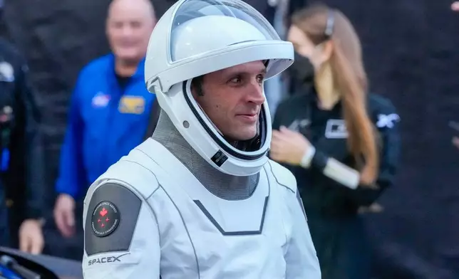 Astronaut Joshua Kutryk, of Canada, leaves the Operations and Checkout Building at the Kennedy Space Center in Cape Canaveral, Fla., Thursday, Oct. 1, 2026. (AP Photo/John Raoux)