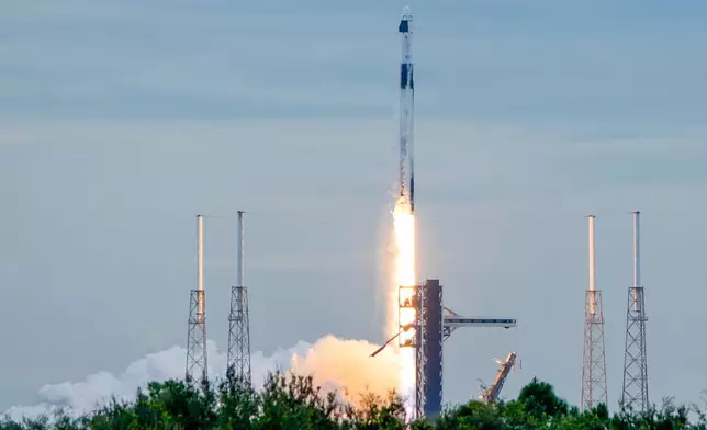 A SpaceX Falcon 9 rocket with a crew of four launches from pad 40 at the Cape Canaveral Space Force Station in Cape Canaveral, Fla., Thursday, Oct. 1, 2026. (AP Photo/John Raoux)