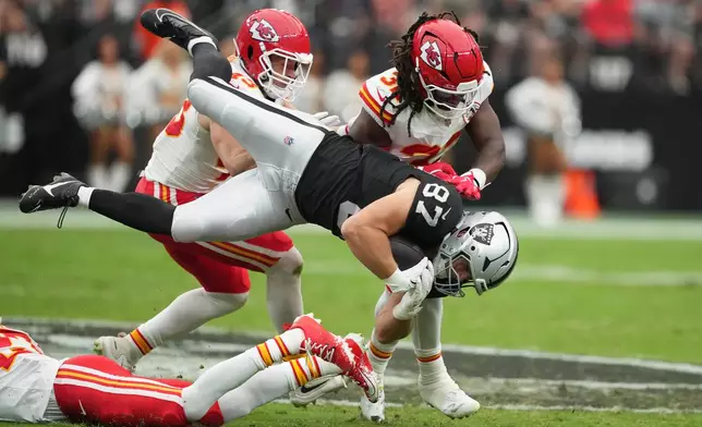 Las Vegas Raiders tight end Michael Mayer (87) dives for yardage during the first half of an NFL football game against the Kansas City Chiefs in Las Vegas, Sunday, Oct. 4, 2026. (AP Photo/Rick Scuteri)