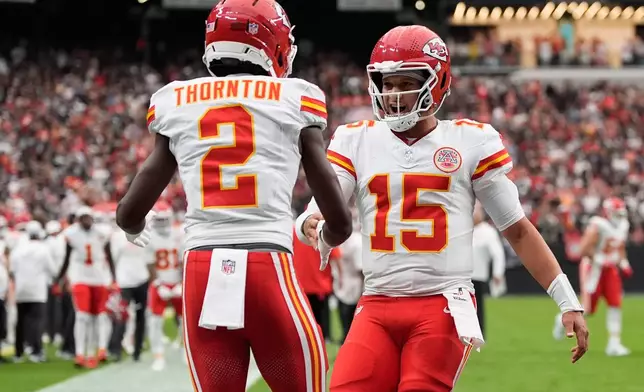 Kansas City Chiefs wide receiver Tyquan Thornton (2) celebrates with quarterback Patrick Mahomes (15) after scoring a touchdown during the first half of an NFL football game against the Las Vegas Raiders in Las Vegas, Sunday, Oct. 4, 2026. (AP Photo/John Locher)