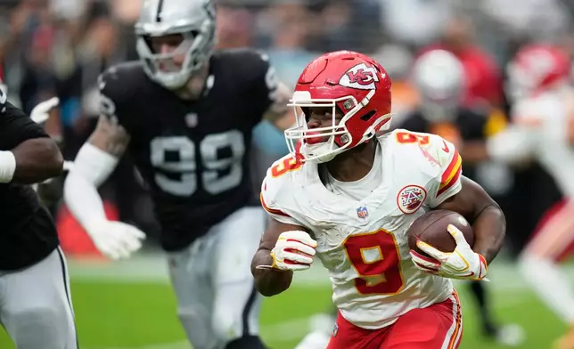 Kansas City Chiefs running back Kenneth Walker (9) runs with the football during the first half of an NFL football game against the Las Vegas Raiders in Las Vegas, Sunday, Oct. 4, 2026. (AP Photo/John Locher)