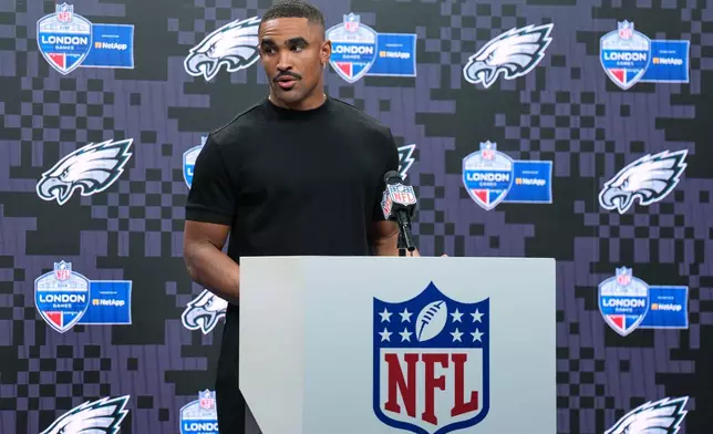 Philadelphia Eagles quarterback Jalen Hurts (1) attends a press conference after an NFL football game against Jacksonville Jaguars in London, Sunday, Oct. 11, 2026. (AP Photo/Alastair Grant)